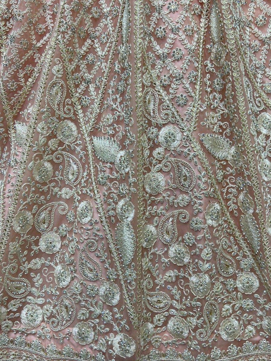Pink designer lehenga with intricate silver floral and paisley embroidery, perfect for Indian ethnic wear.