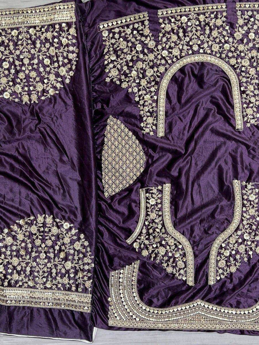 Purple velvet lehenga choli with gold floral embroidery and detailed neckline design