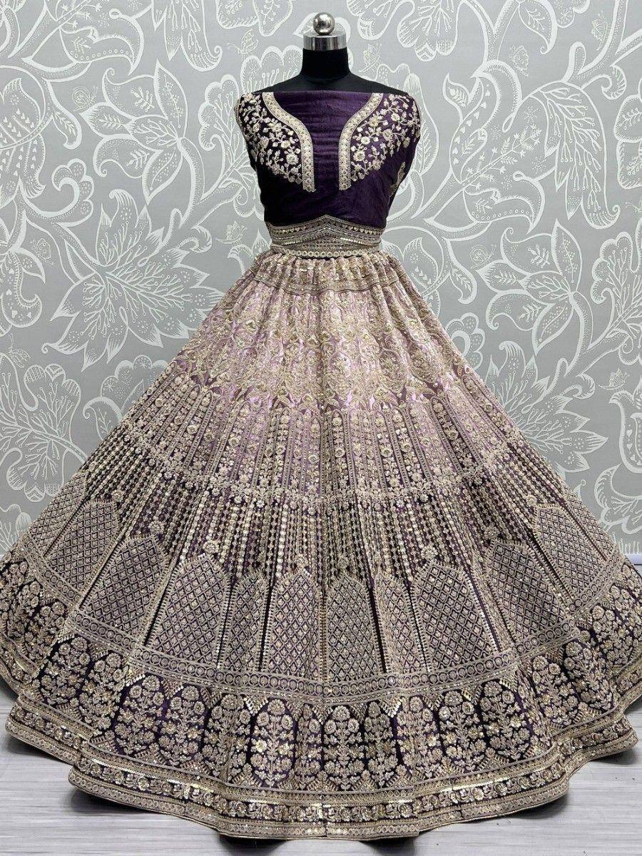 Purple and gold embroidered lehenga choli with heavy zari work, perfect for weddings and festivals