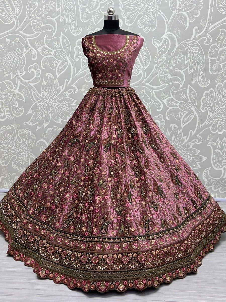 Pink embroidered lehenga choli with floral and paisley motifs, perfect for Indian ethnic occasions