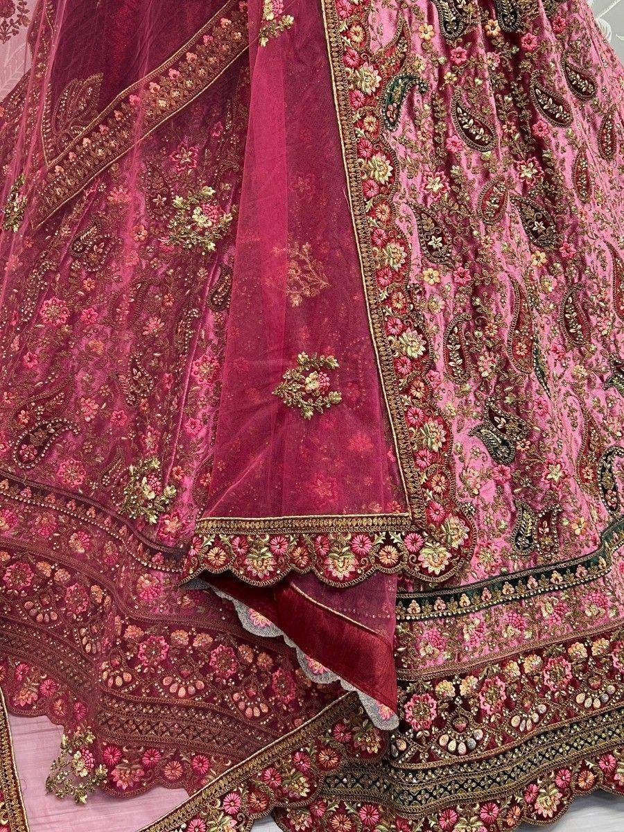 Pink and maroon designer lehenga with intricate floral embroidery and gold detailing
