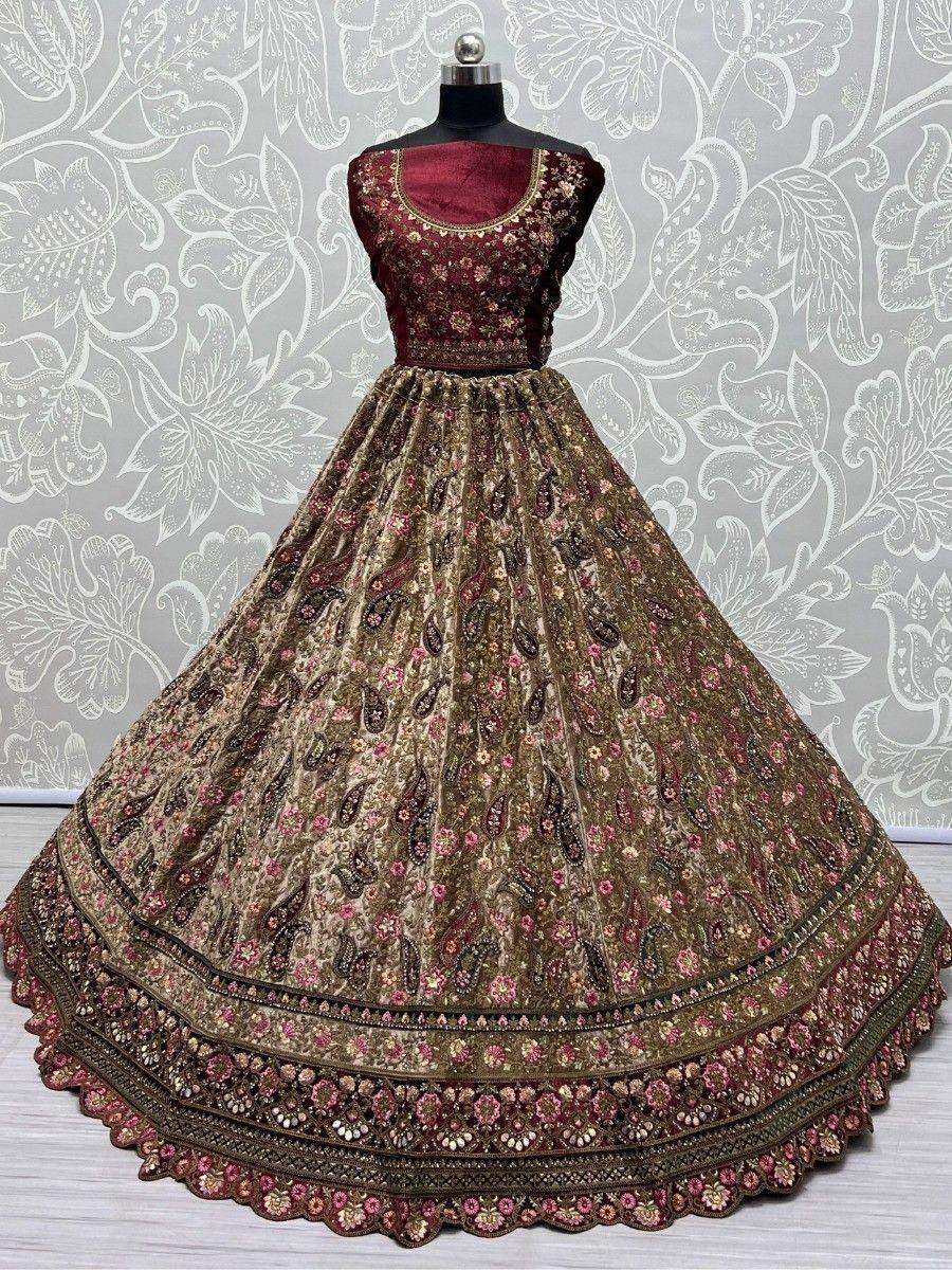 Maroon and gold embroidered lehenga choli with floral paisley design, perfect for Indian weddings and festivals