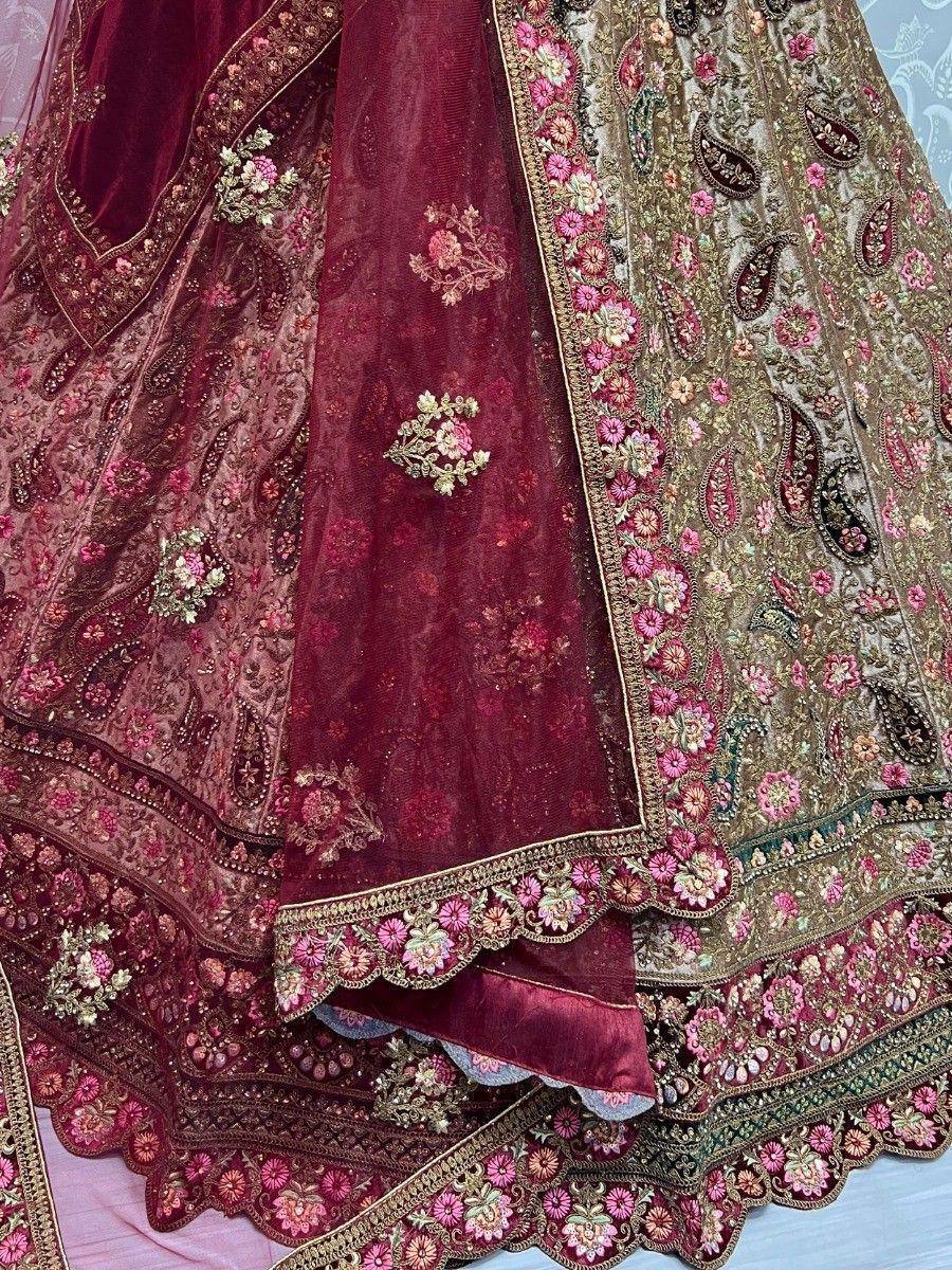 Luxury maroon lehenga choli with intricate floral embroidery and gold detailing, perfect for weddings