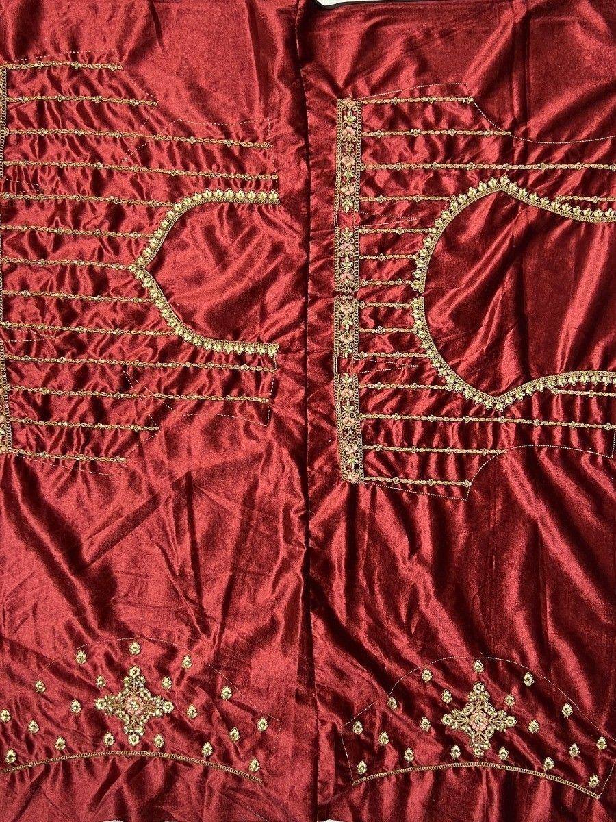 Rich red velvet lehenga choli with gold embroidery and beadwork, perfect for Indian ethnic wear