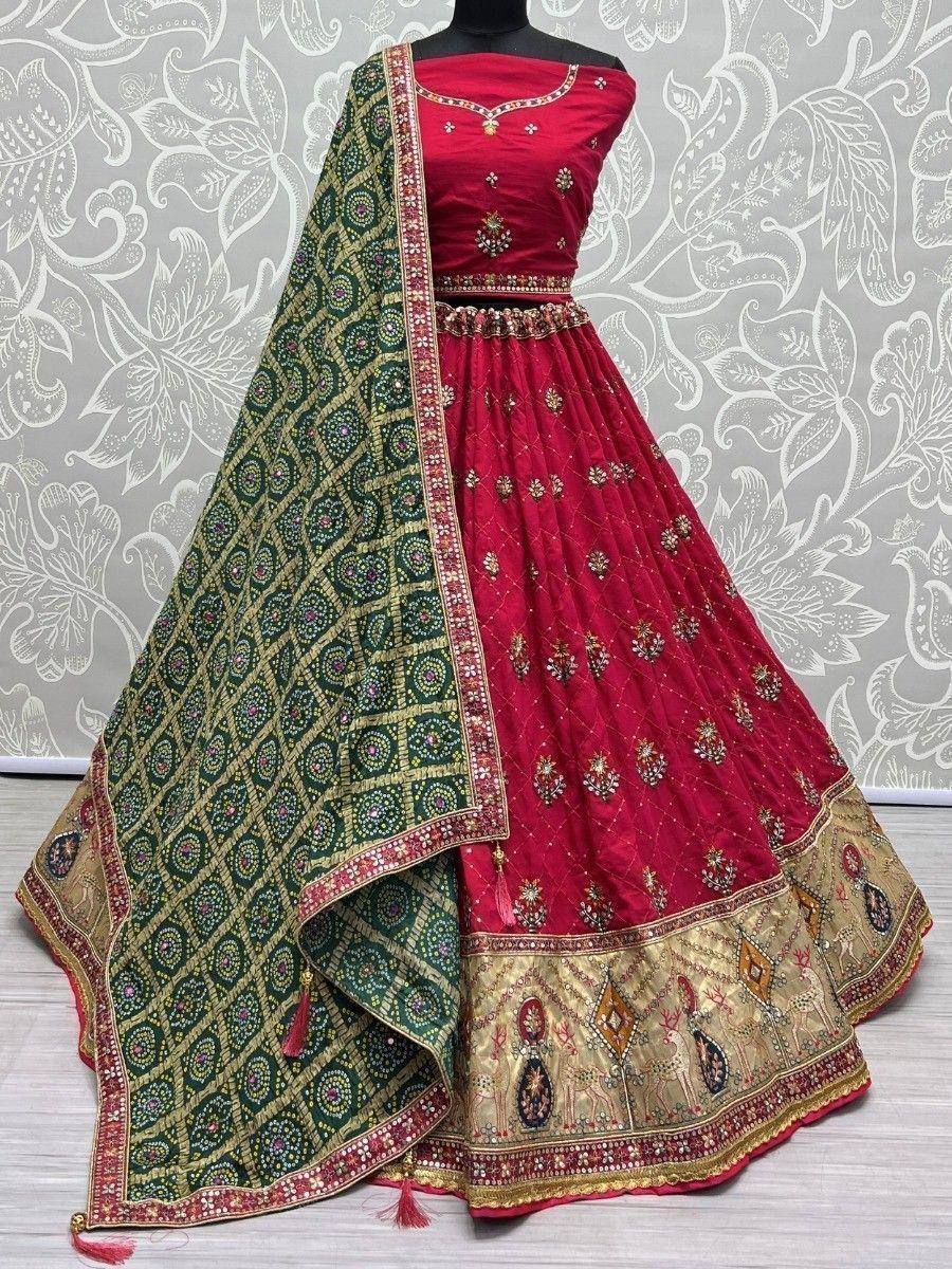 Red embroidered lehenga choli with green dupatta, ethnic Indian wear for weddings and festivals