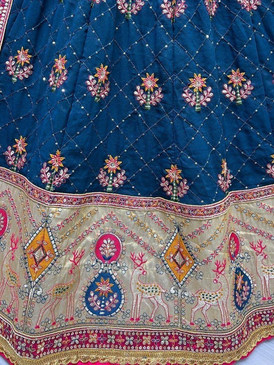 Blue embroidered lehenga with deer motifs and floral mirror work, ethnic Indian wear