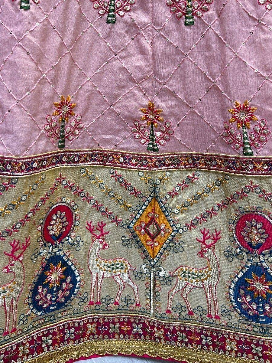 Pink and gold embroidered lehenga with deer motifs and mirror work, ideal for Indian ethnic wear