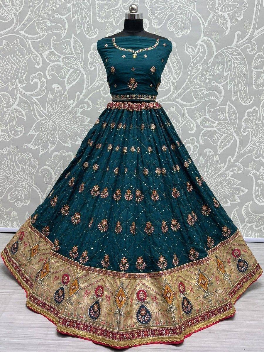 Teal designer lehenga choli with gold embroidery and floral border, perfect for Indian weddings and festivals