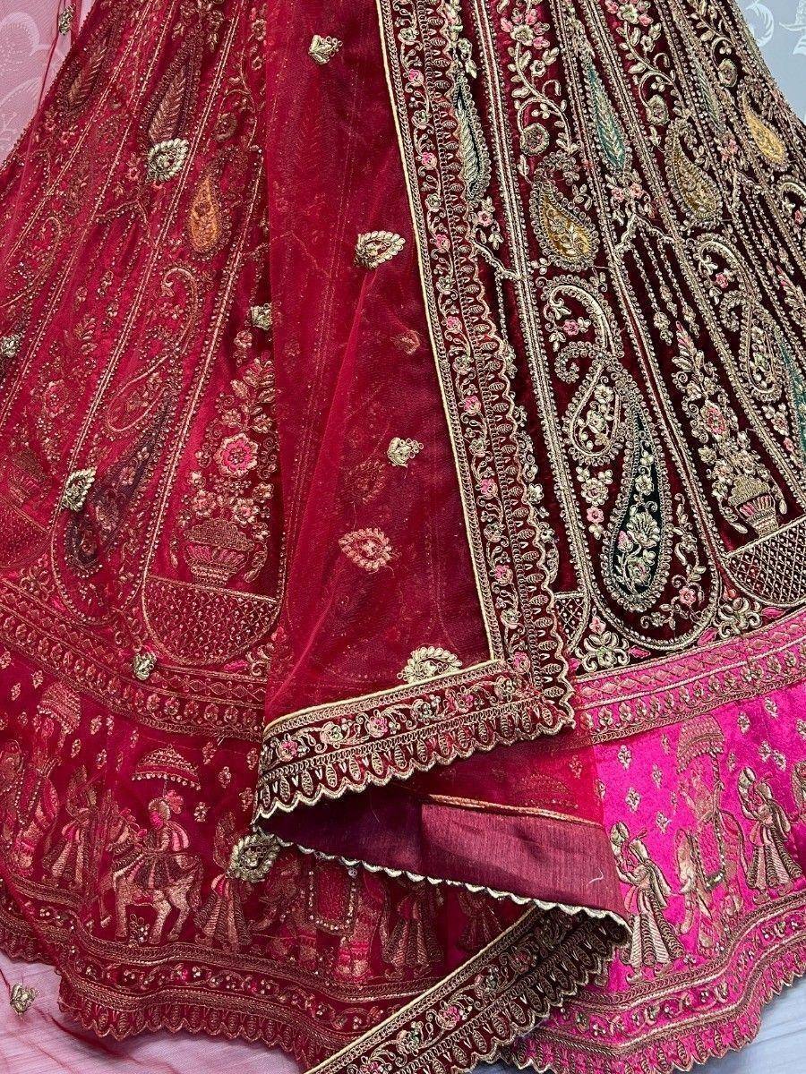 Richly embroidered maroon lehenga with gold paisley and floral motifs, perfect for Indian weddings