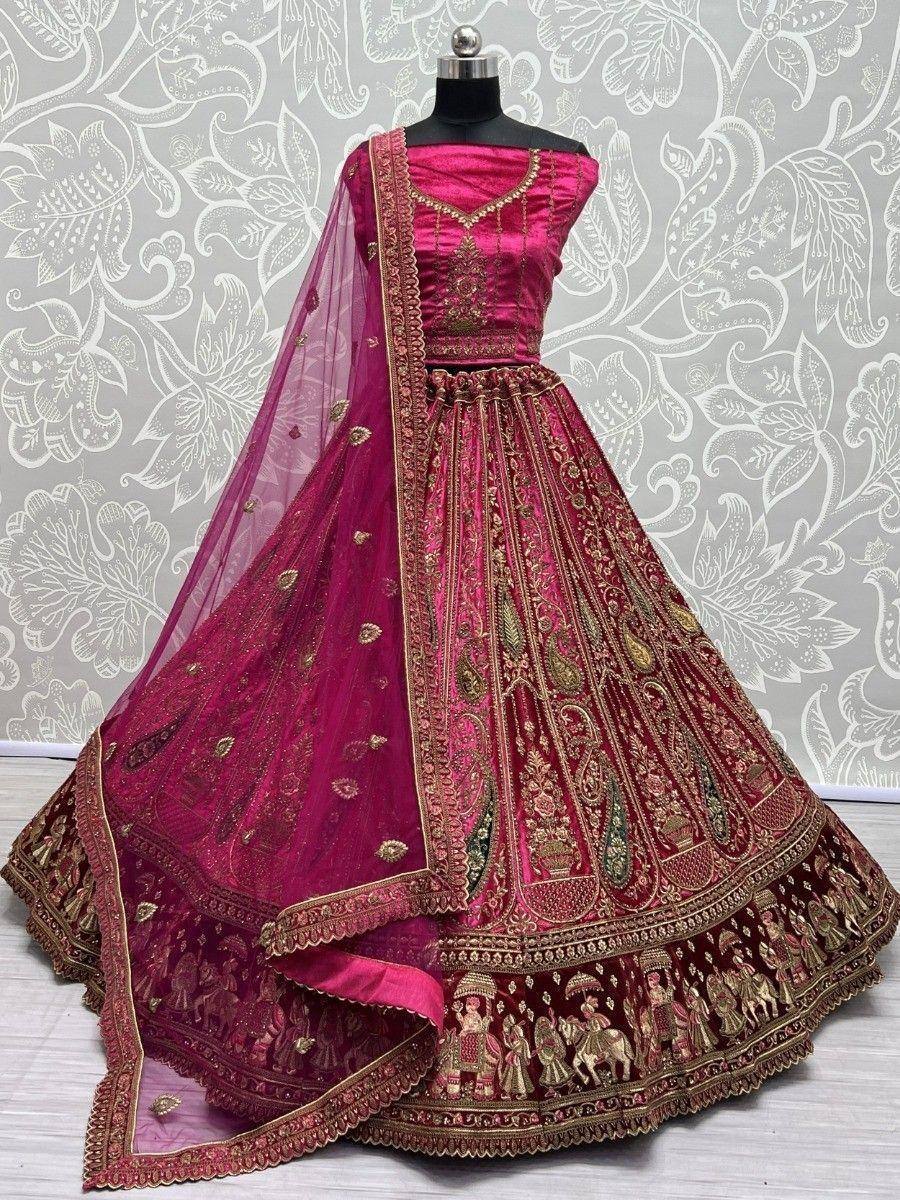 Pink and maroon designer lehenga choli with gold embroidery and sheer dupatta, perfect for weddings and festive occasions.