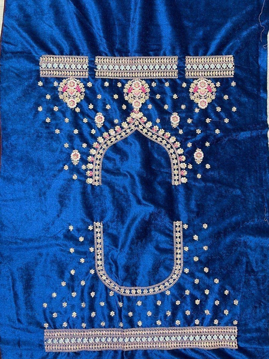 Blue velvet ethnic blouse with floral embroidery and mirror work, perfect for Indian weddings and parties.