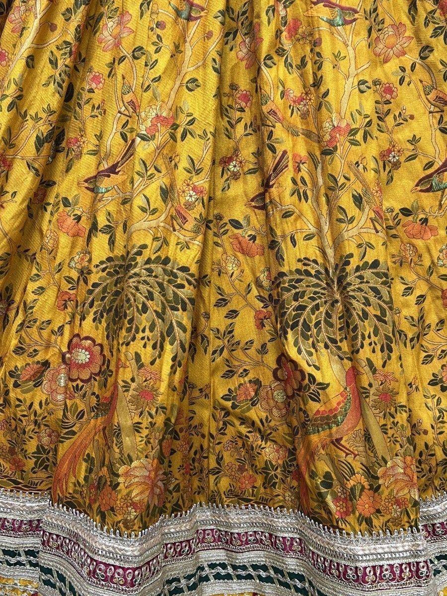 Yellow lehenga with floral bird print and embroidered border, ethnic Indian wear