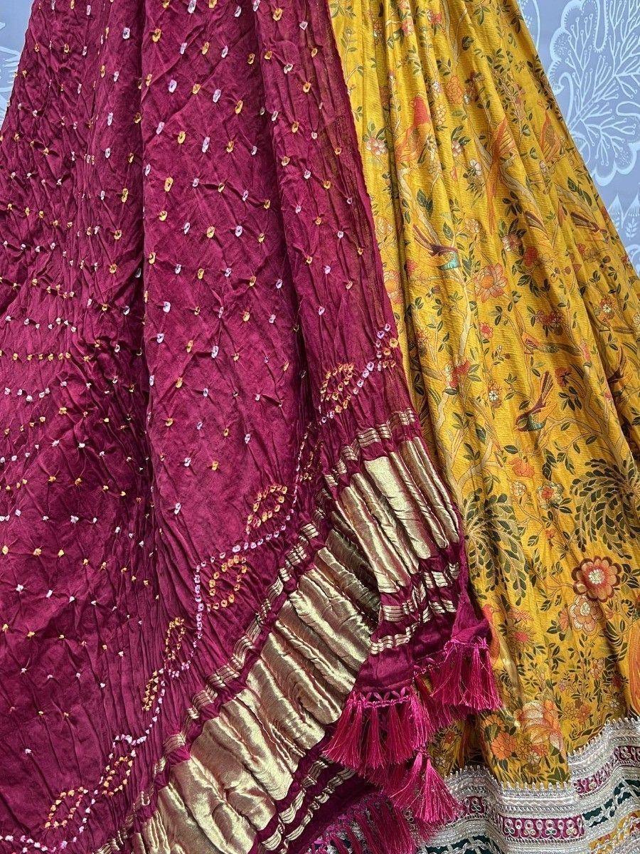 Maroon and yellow ethnic lehenga skirts with embroidery, tassels, and floral prints for Indian wear