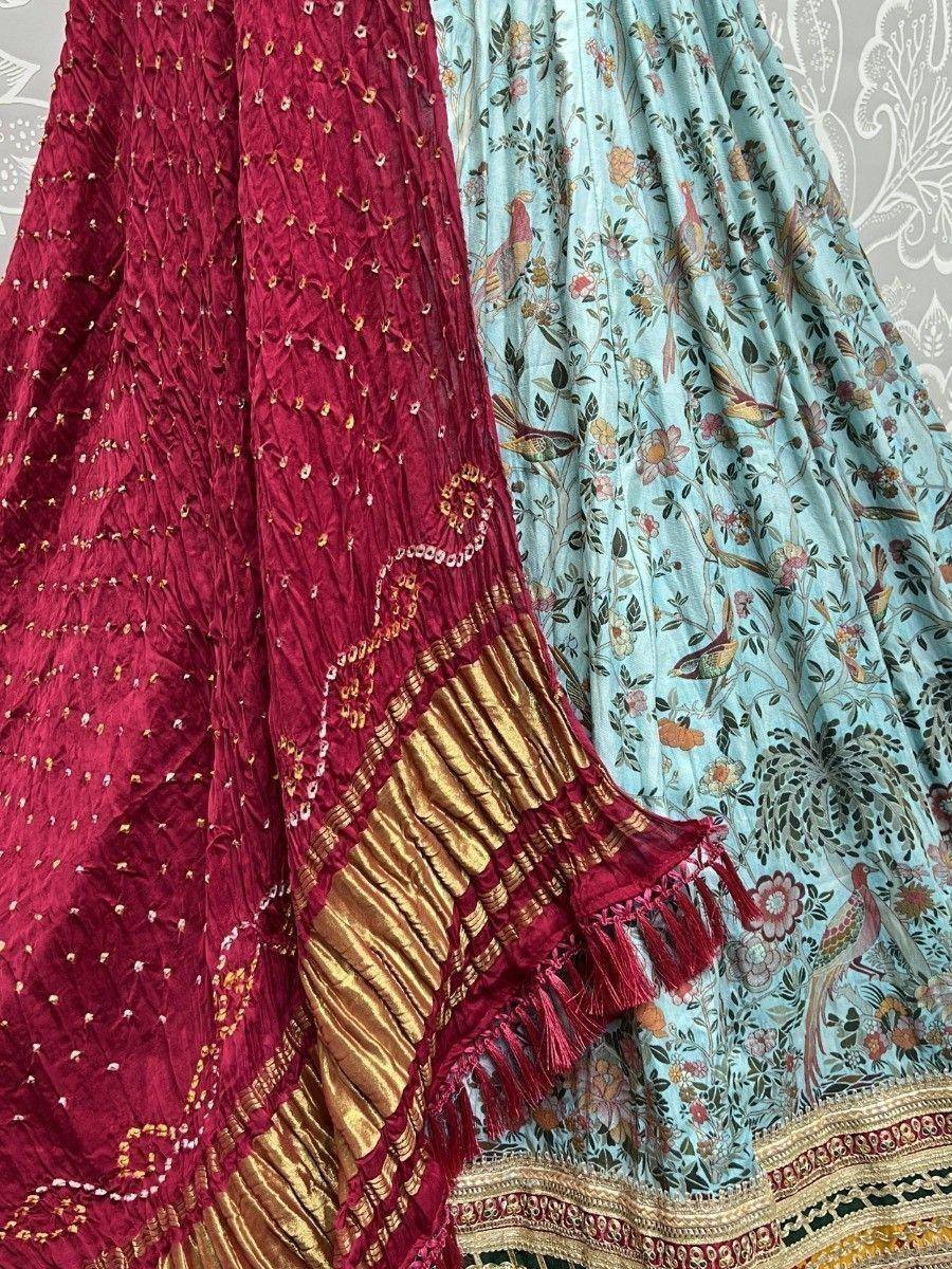 Red embroidered dupatta with gold border and light blue floral print lehenga, Indian ethnic wear