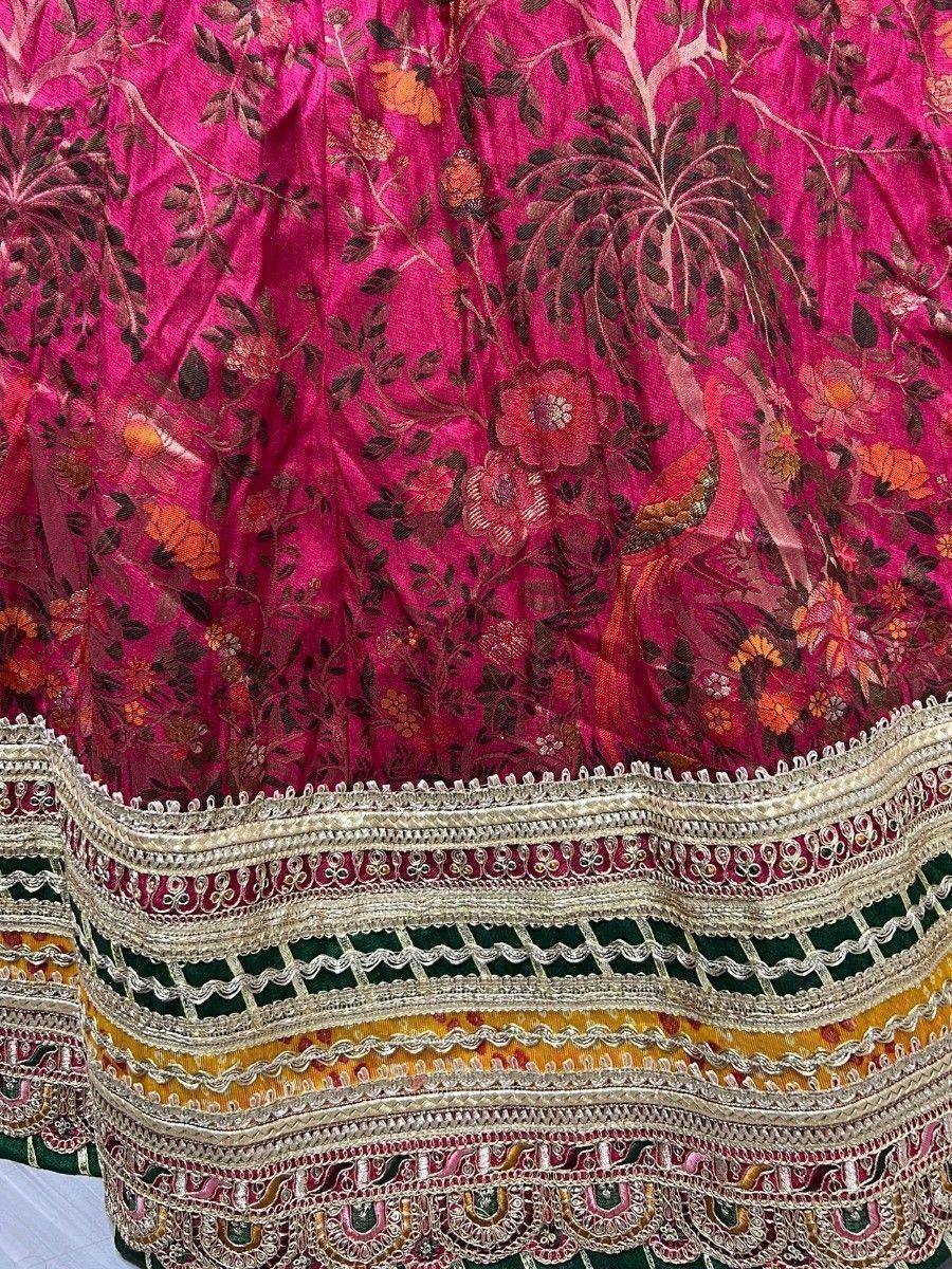 Pink floral embroidered lehenga with peacock motifs and intricate gold border detailing