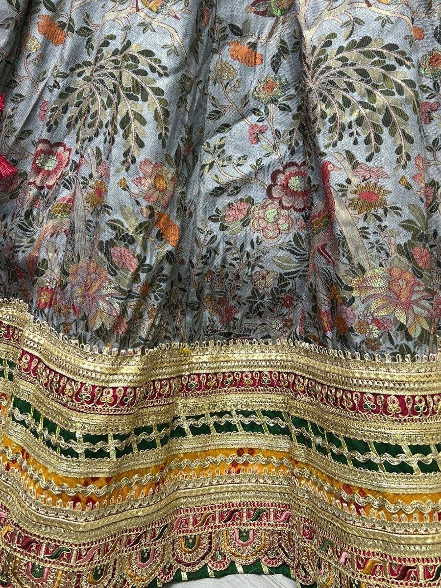 Grey floral embroidered lehenga with gold and colorful border detailing