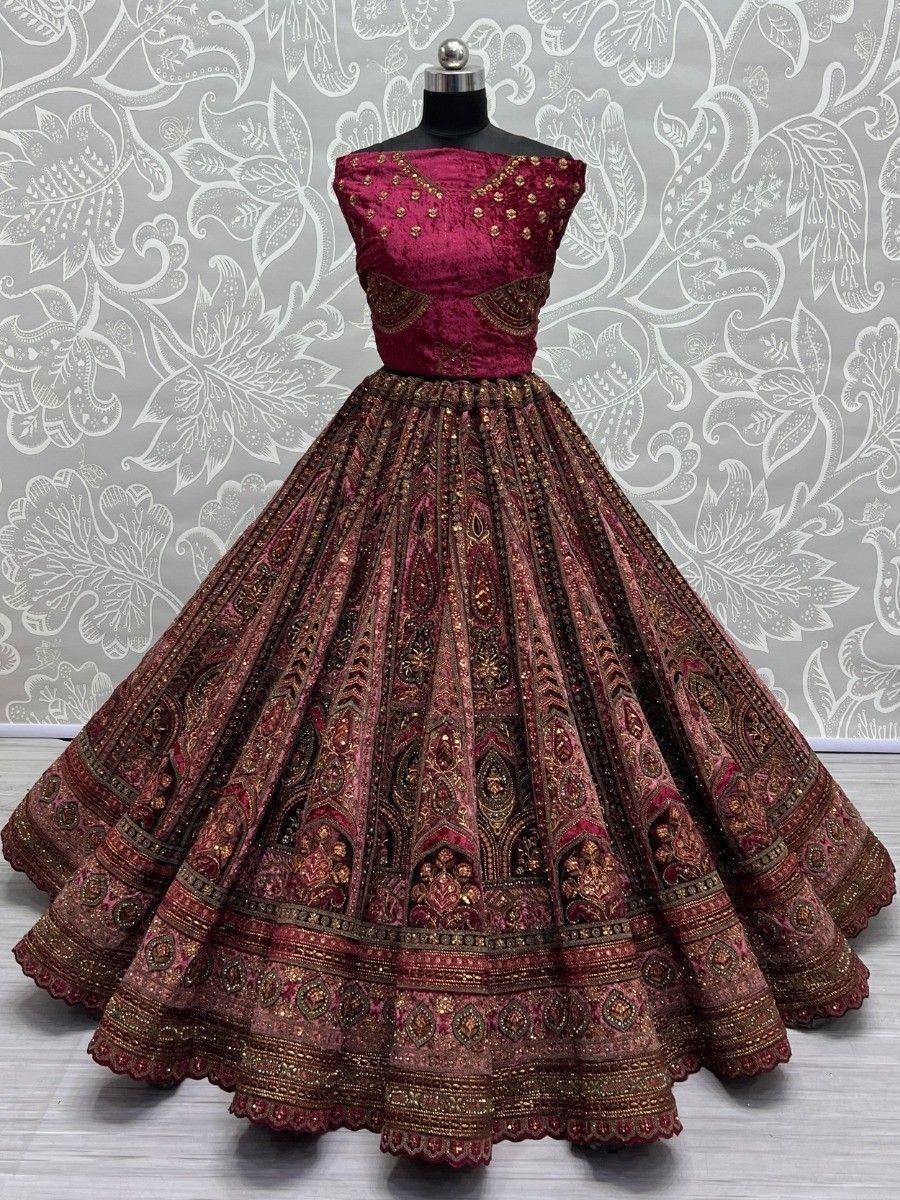 Maroon designer lehenga choli with gold embroidery, perfect for Indian weddings and festive occasions.