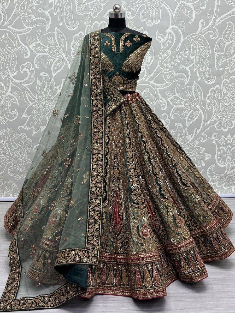Emerald green designer lehenga choli with gold embroidery and sheer dupatta, perfect for Indian weddings