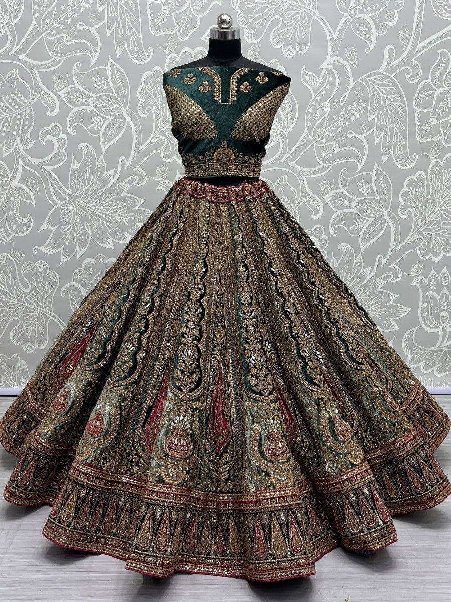 Emerald green and gold embroidered lehenga choli with intricate paisley detailing, perfect for Indian weddings.