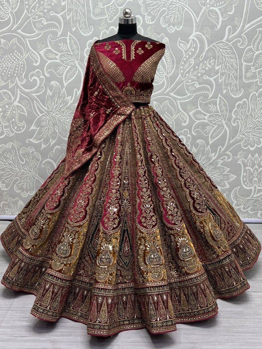 Maroon and gold designer lehenga choli with intricate embroidery, perfect for Indian weddings and festive occasions.