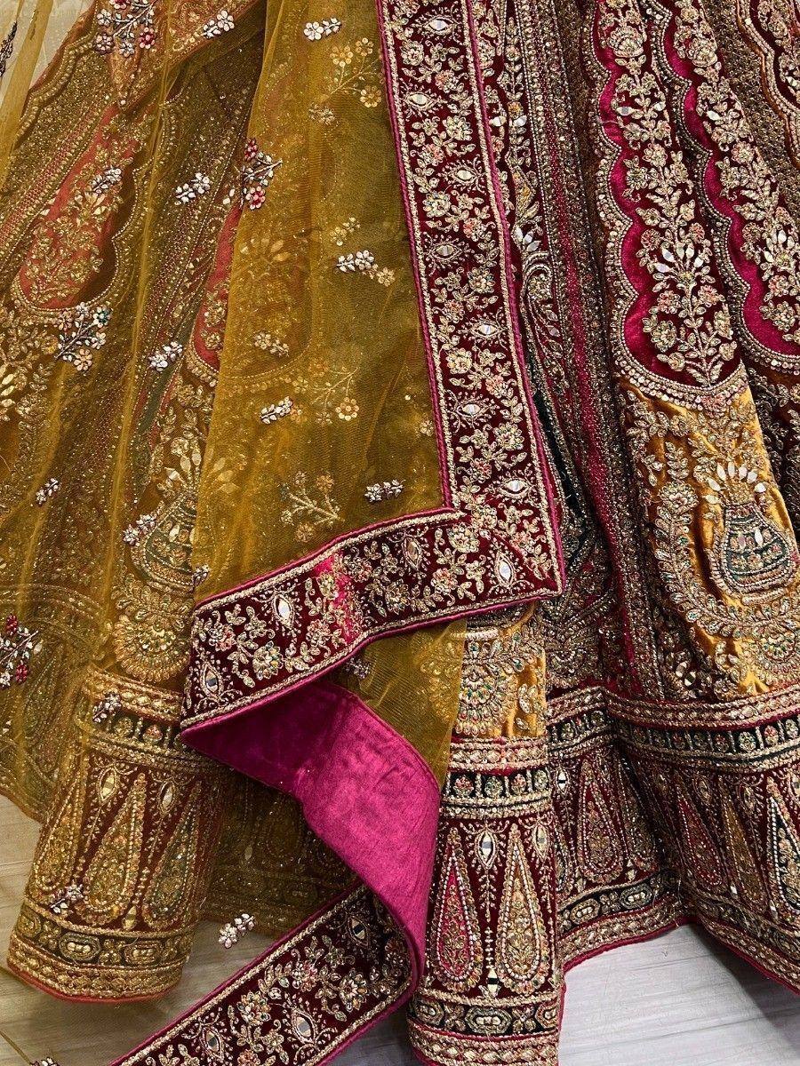 Luxury Indian lehenga choli with gold and maroon embroidery, perfect for weddings and festivals.