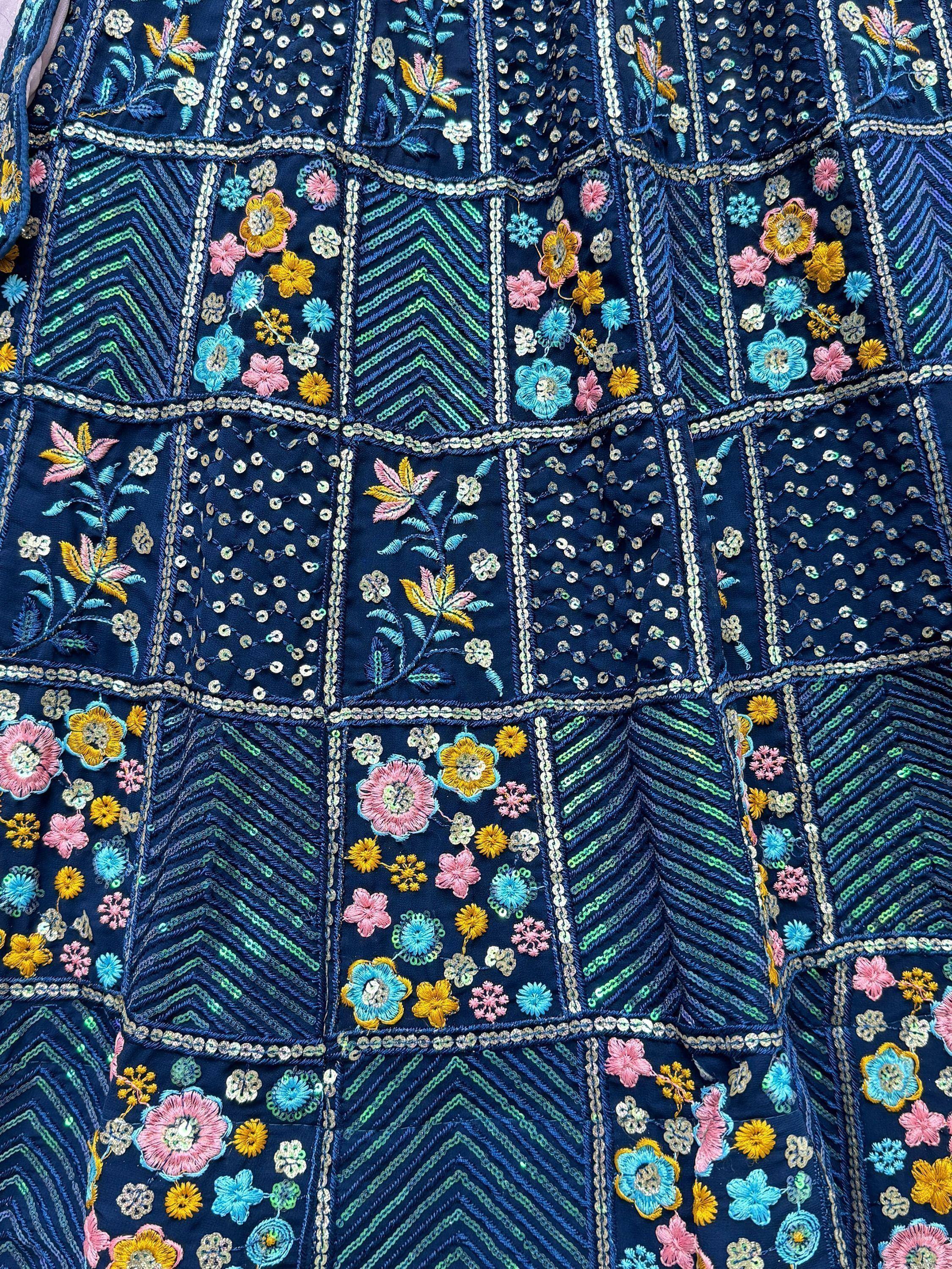 Navy blue ethnic wear with floral embroidery and sequin detailing, perfect for Indian festive occasions.