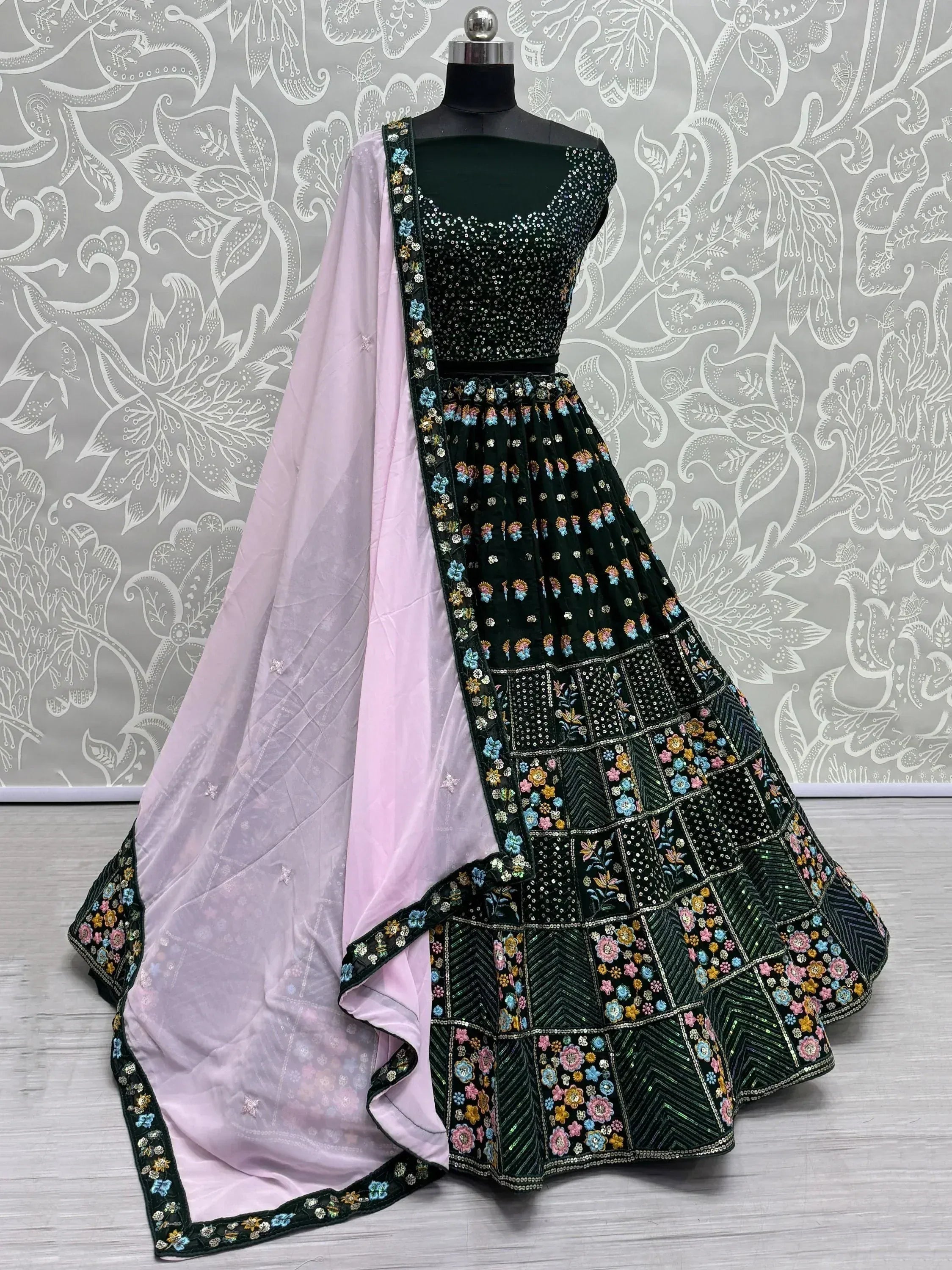 Dark green embroidered lehenga choli with floral motifs and light pink dupatta, Indian ethnic wear