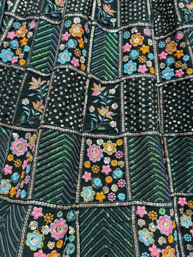 Black ethnic wear with colorful floral embroidery and sequin patchwork design