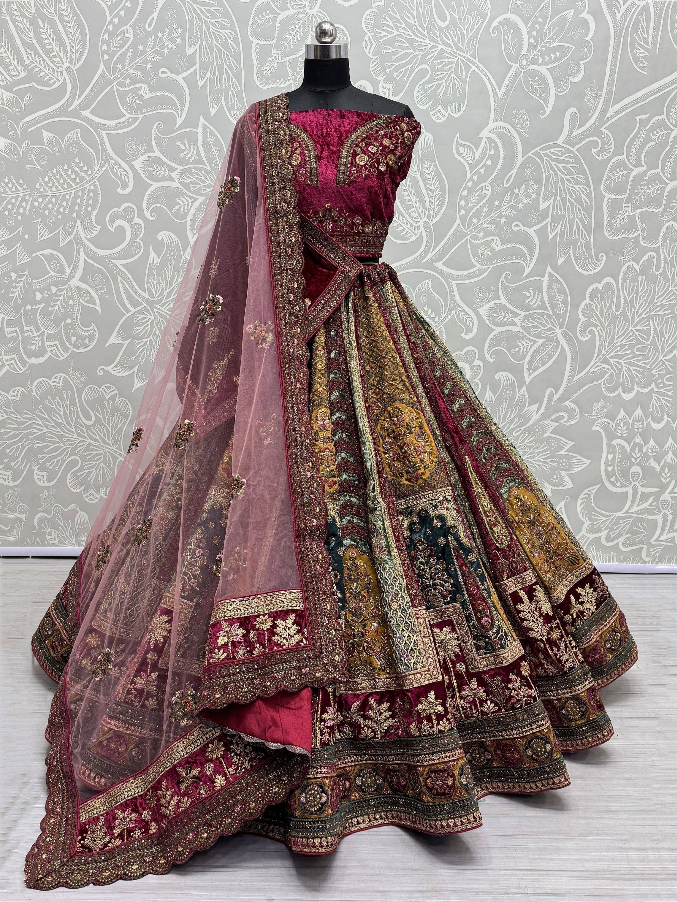 Maroon velvet designer lehenga choli with gold embroidery and sheer dupatta, ethnic Indian wear