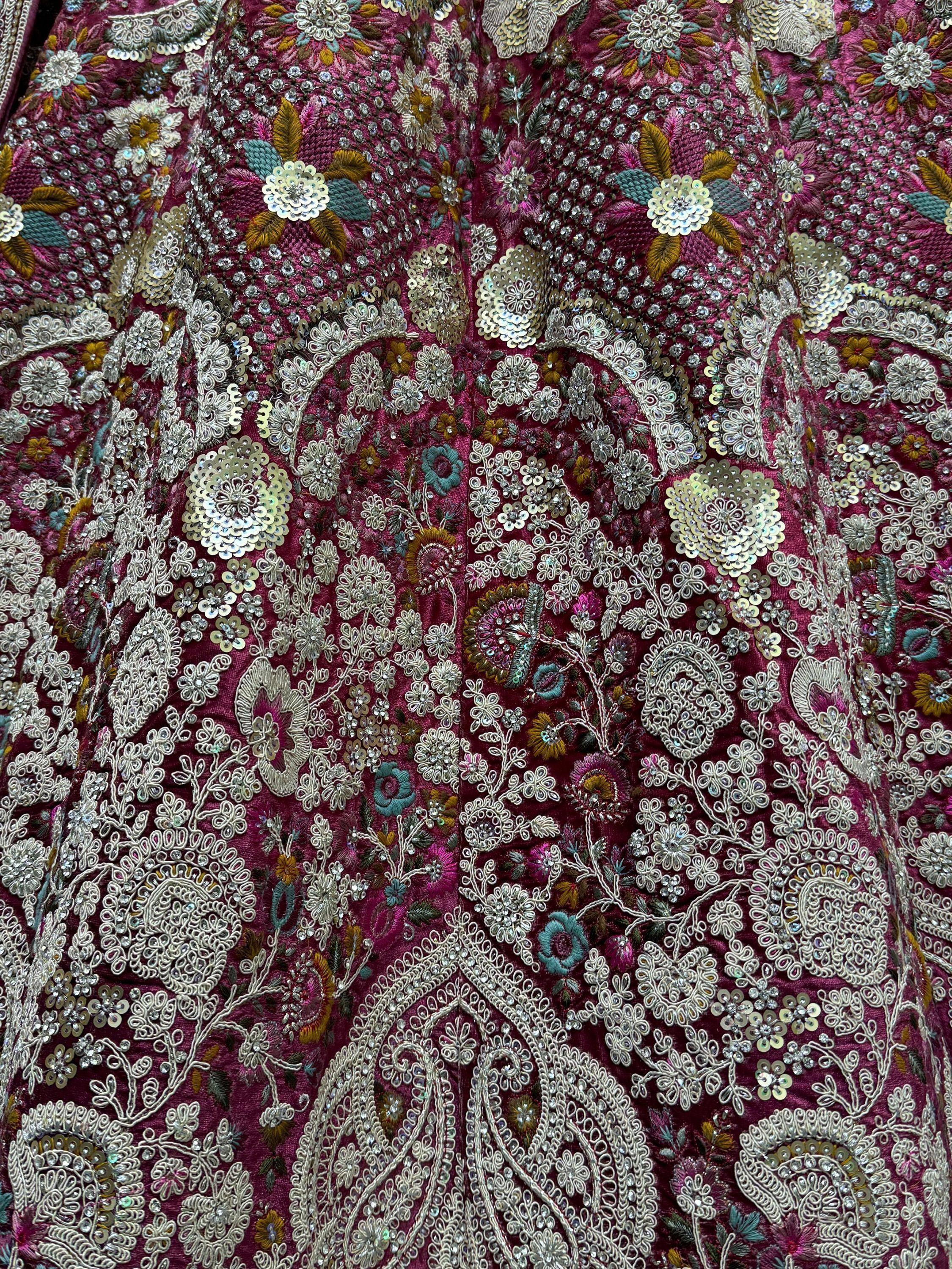 Richly embroidered maroon Indian ethnic wear with floral sequin and bead detailing