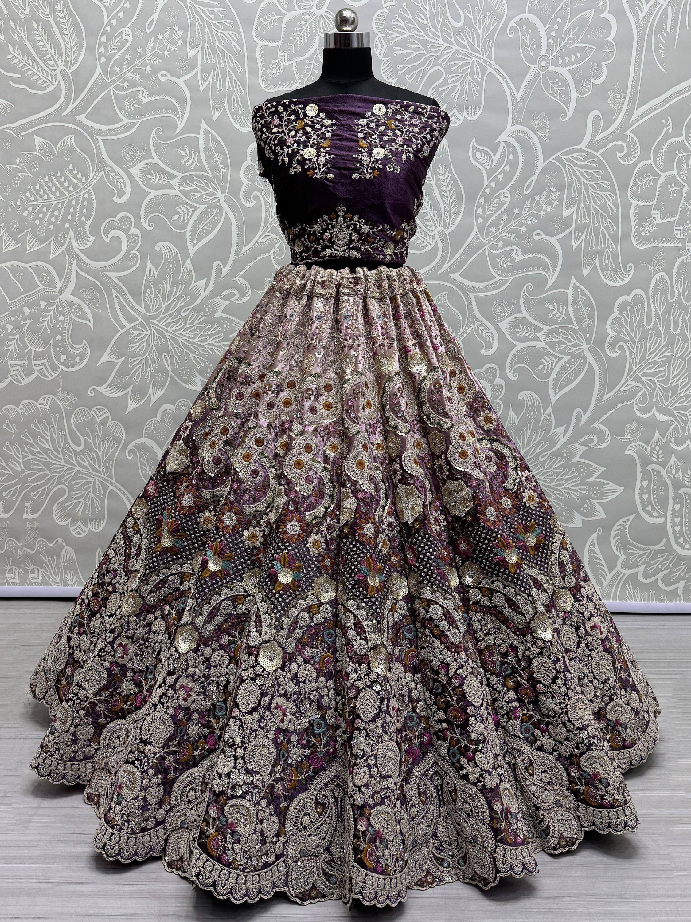 Purple embroidered lehenga choli with floral and paisley motifs, perfect for Indian ethnic wear occasions