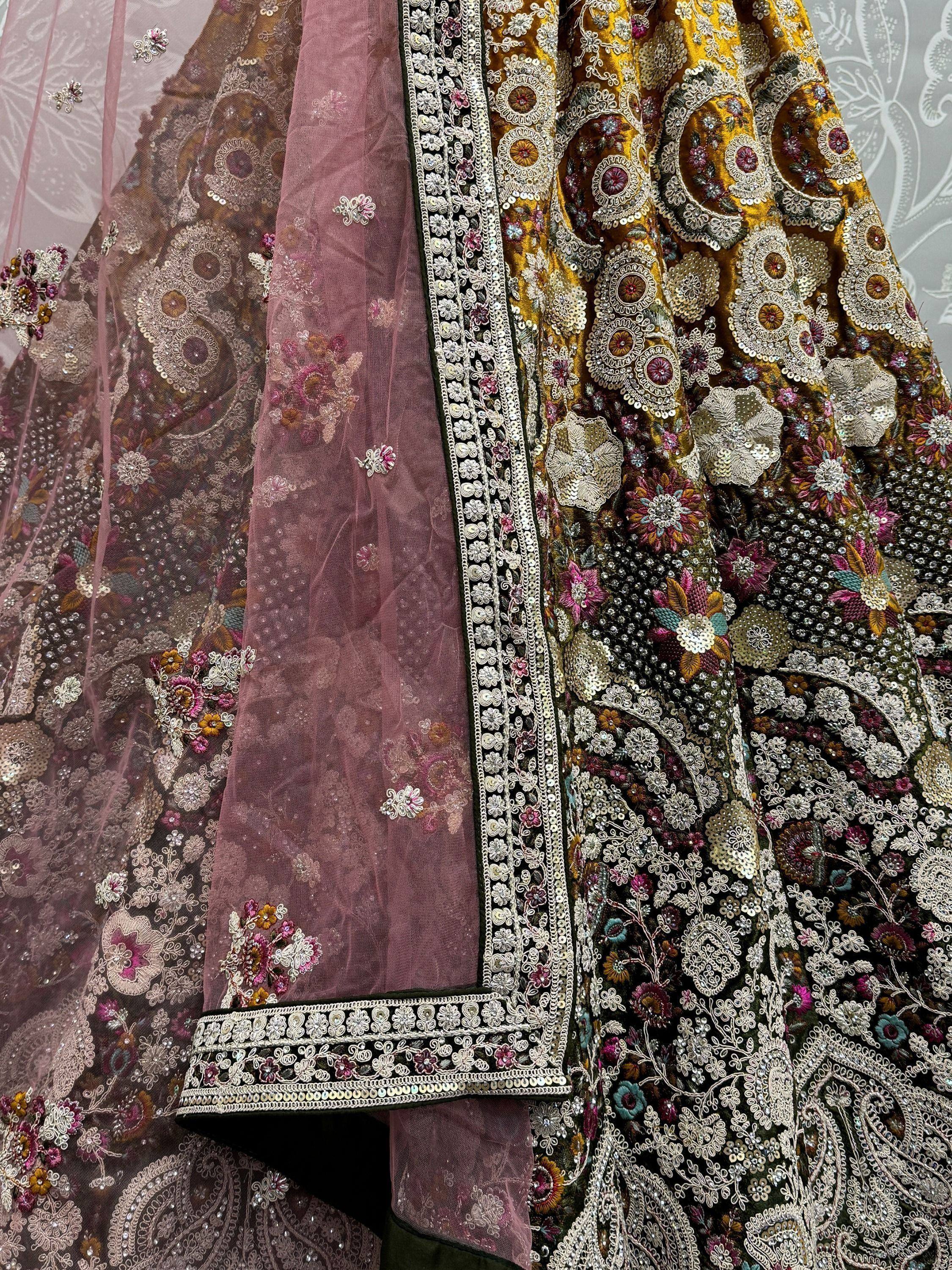 Luxury Indian lehenga choli with intricate floral embroidery and sequin work on velvet and net fabric