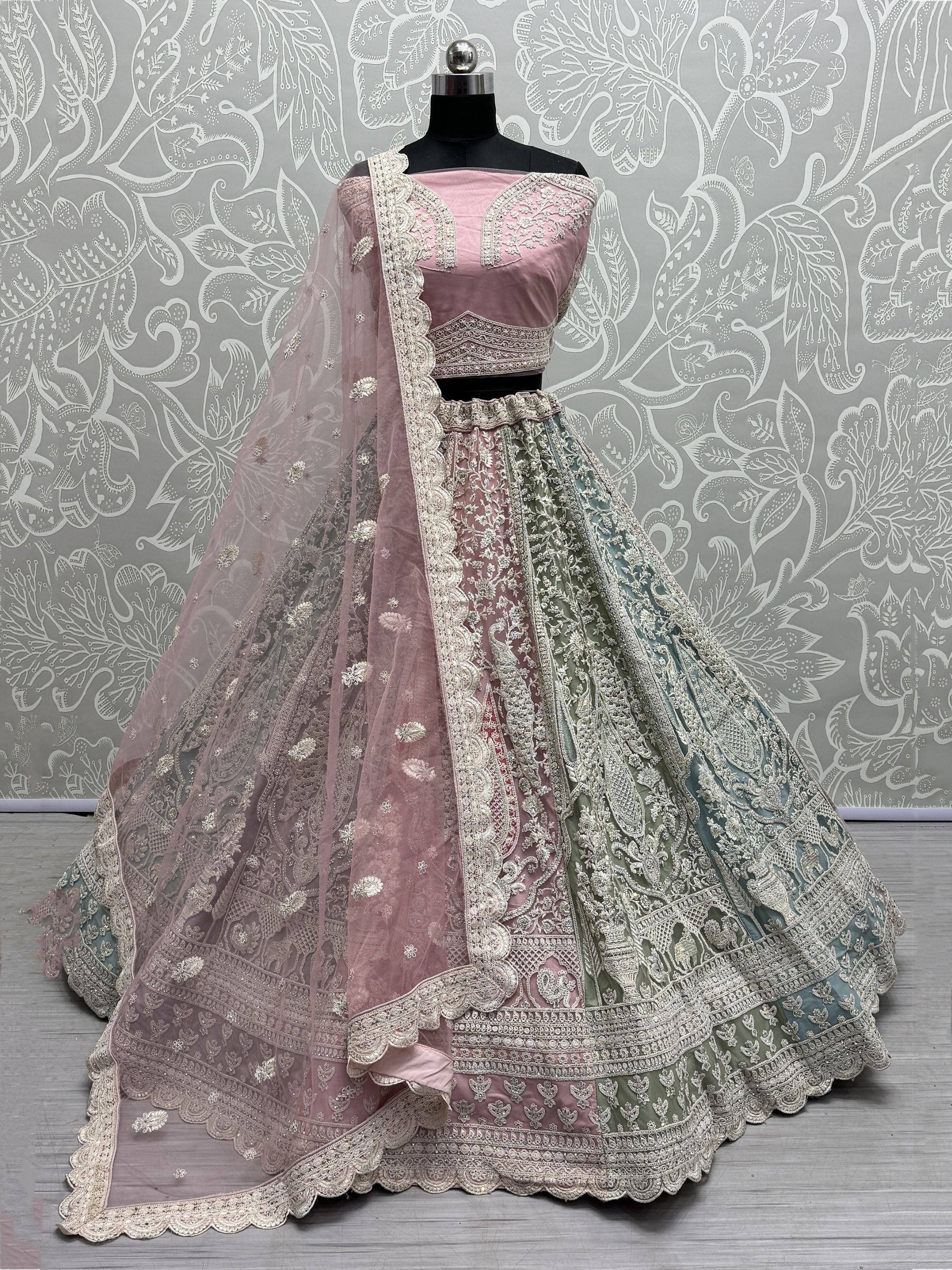 Pink and mint green designer lehenga choli with heavy embroidery and dupatta, perfect for weddings and parties