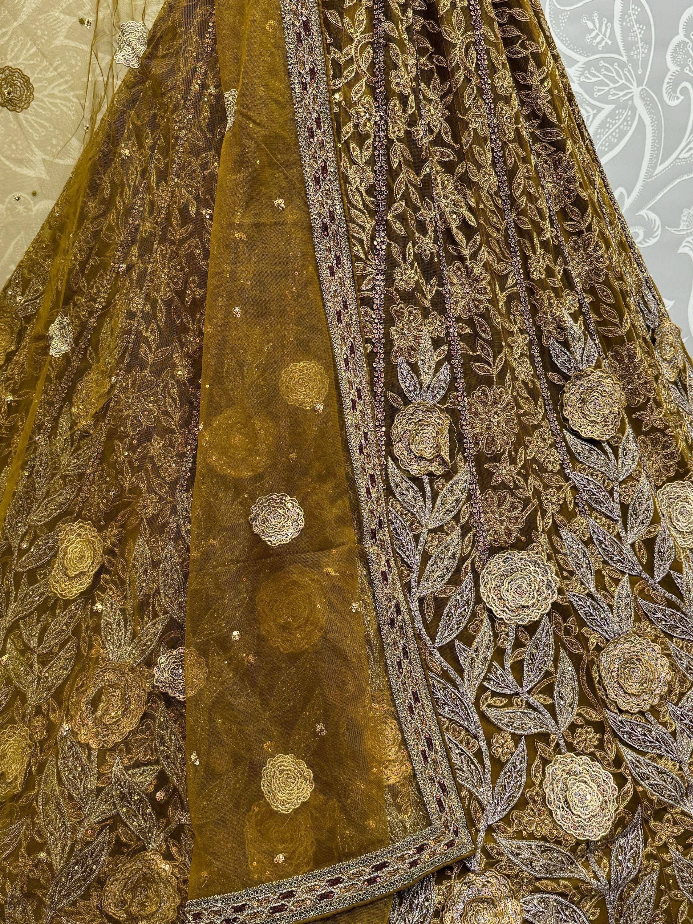 Olive green designer lehenga with intricate gold floral embroidery and sequin work, perfect for Indian ethnic wear.