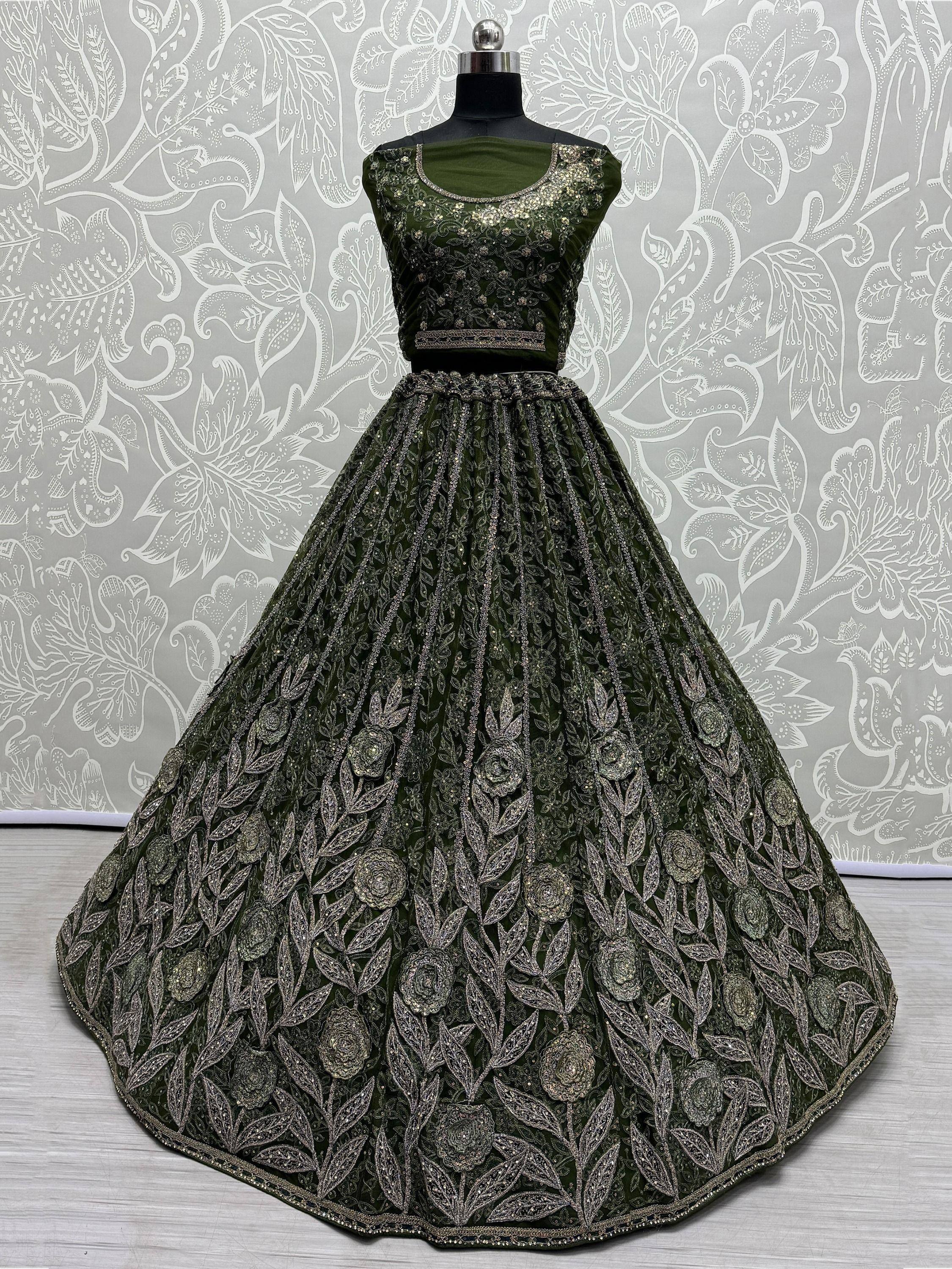 Olive green designer lehenga choli with heavy silver floral embroidery, perfect for weddings and parties.
