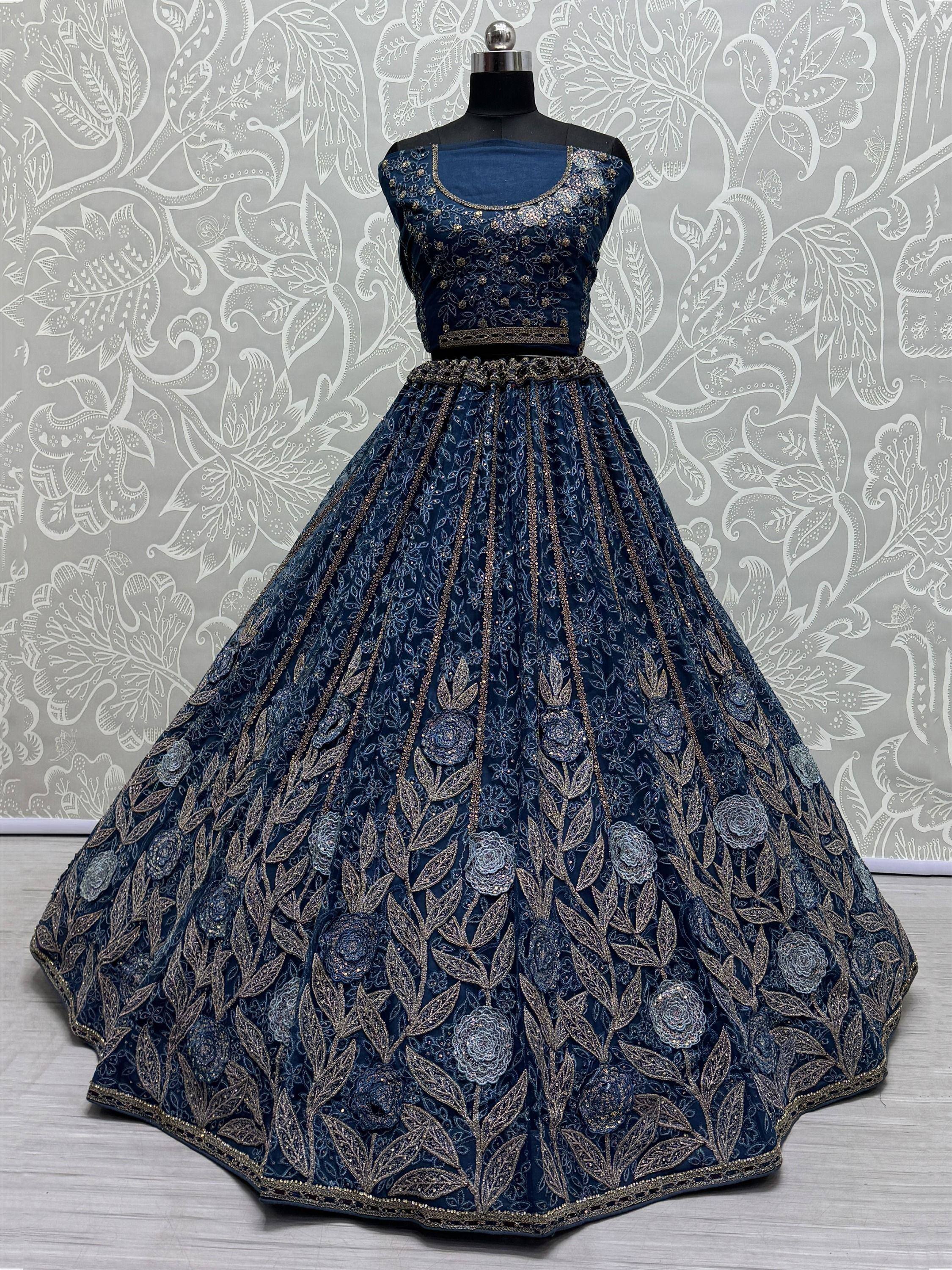 Navy blue designer lehenga choli with gold floral embroidery, perfect for Indian weddings and festive occasions.