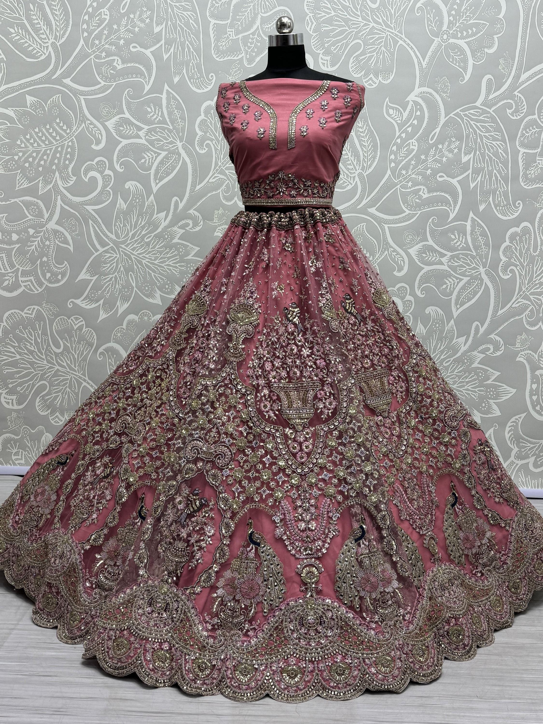 Enchanting Pink Sequins Net Engagement Wear Lehenga Choli