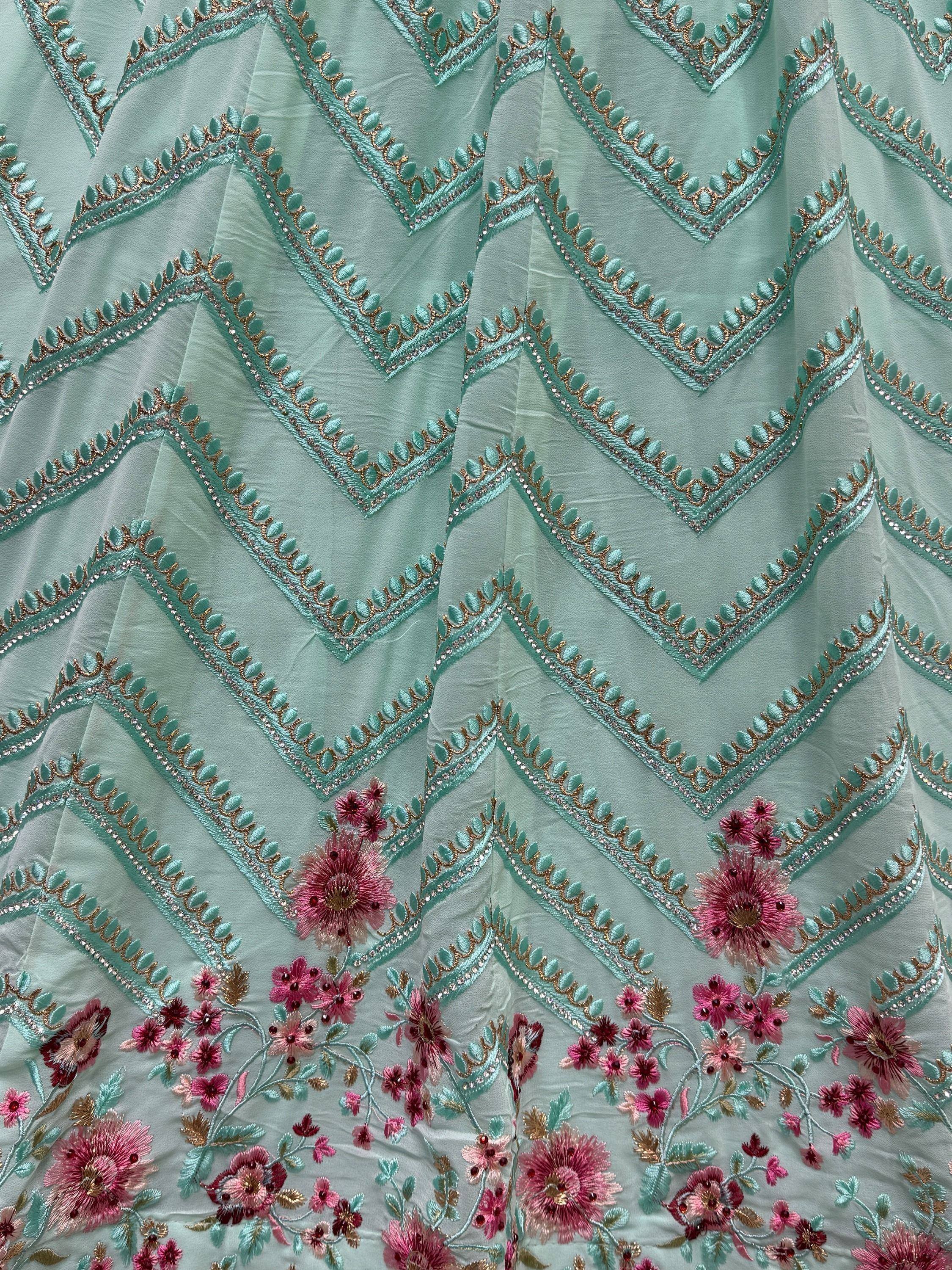 Mint green ethnic dress with zigzag embroidery and pink floral designs