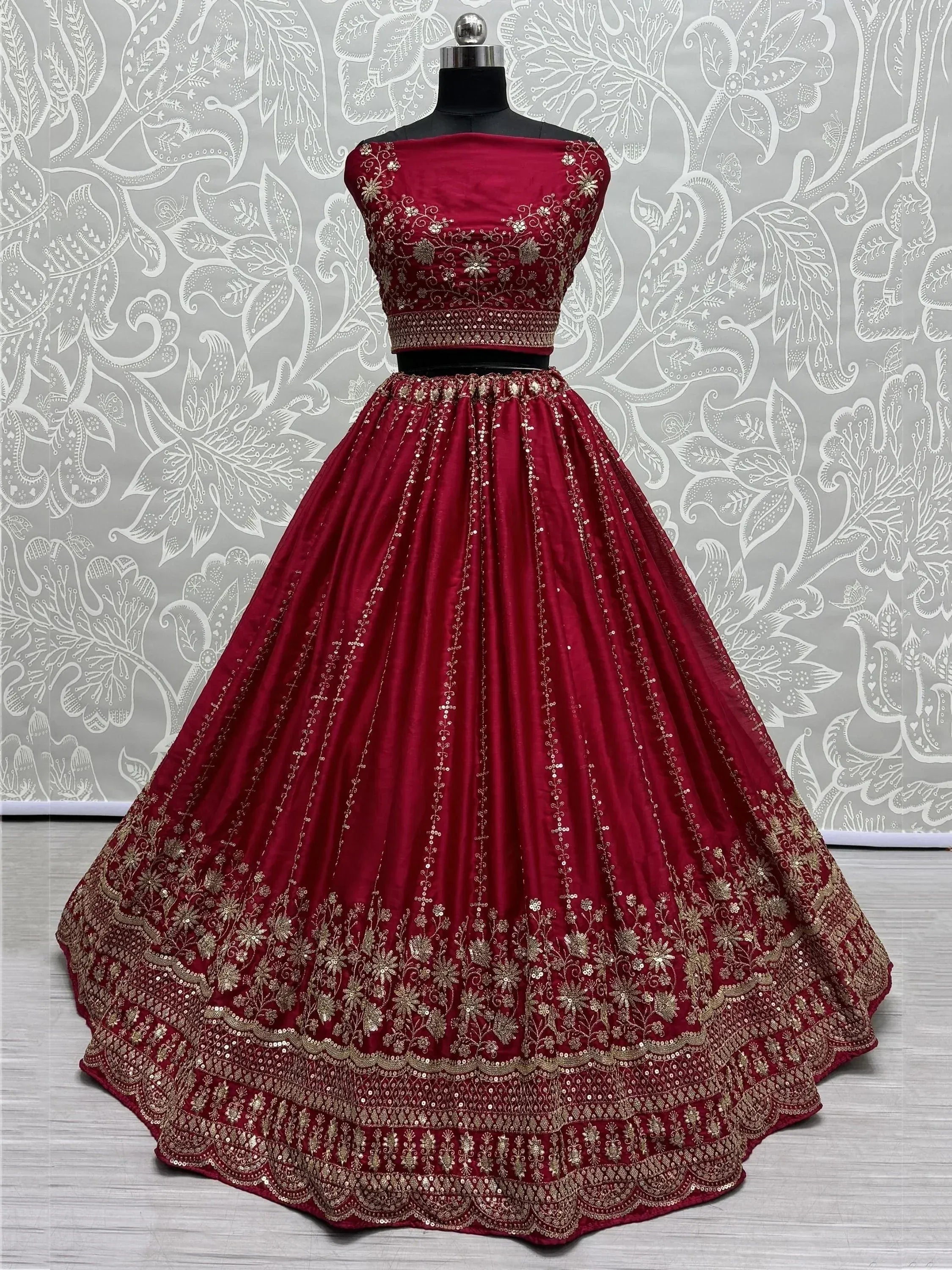Maroon designer lehenga choli with gold embroidery and sequins for Indian ethnic wear