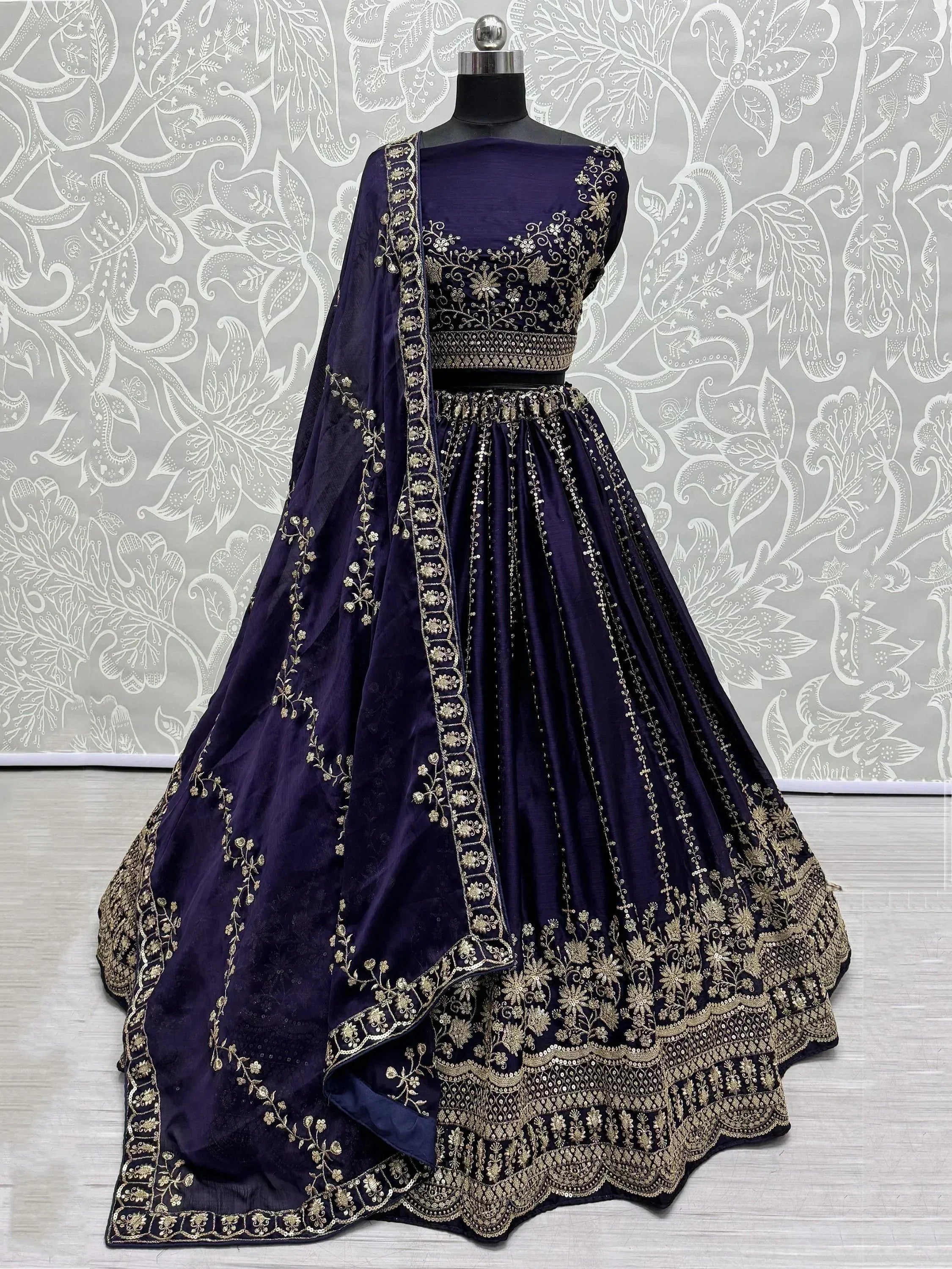 Elegant purple lehenga choli with gold embroidery, perfect for Indian ethnic wear occasions.