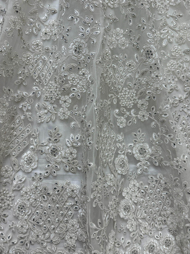 Gorgeous White Embroidered Net Reception Wear Lehenga Choli