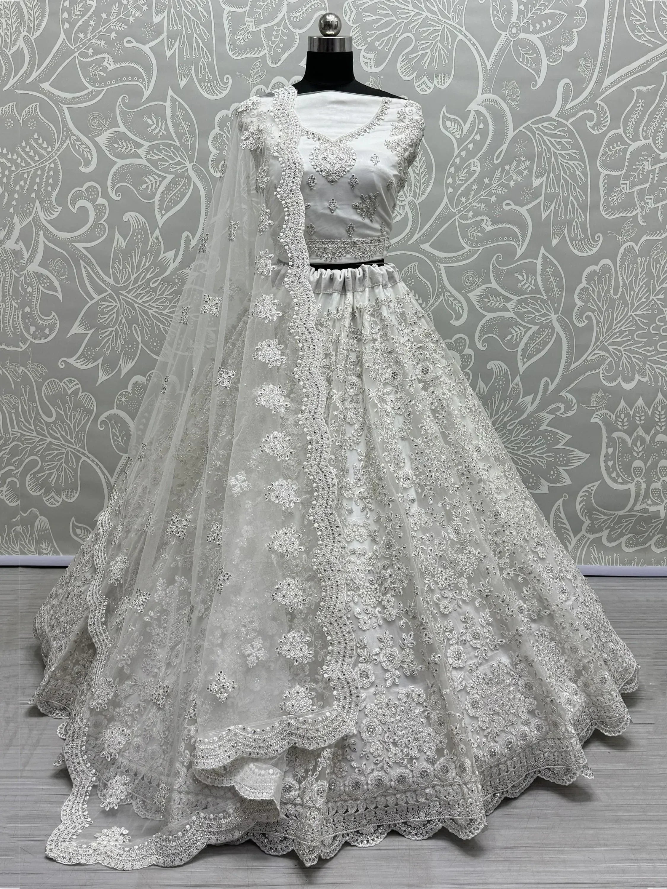 White embroidered lehenga choli with net dupatta, Indian ethnic wear for weddings and parties