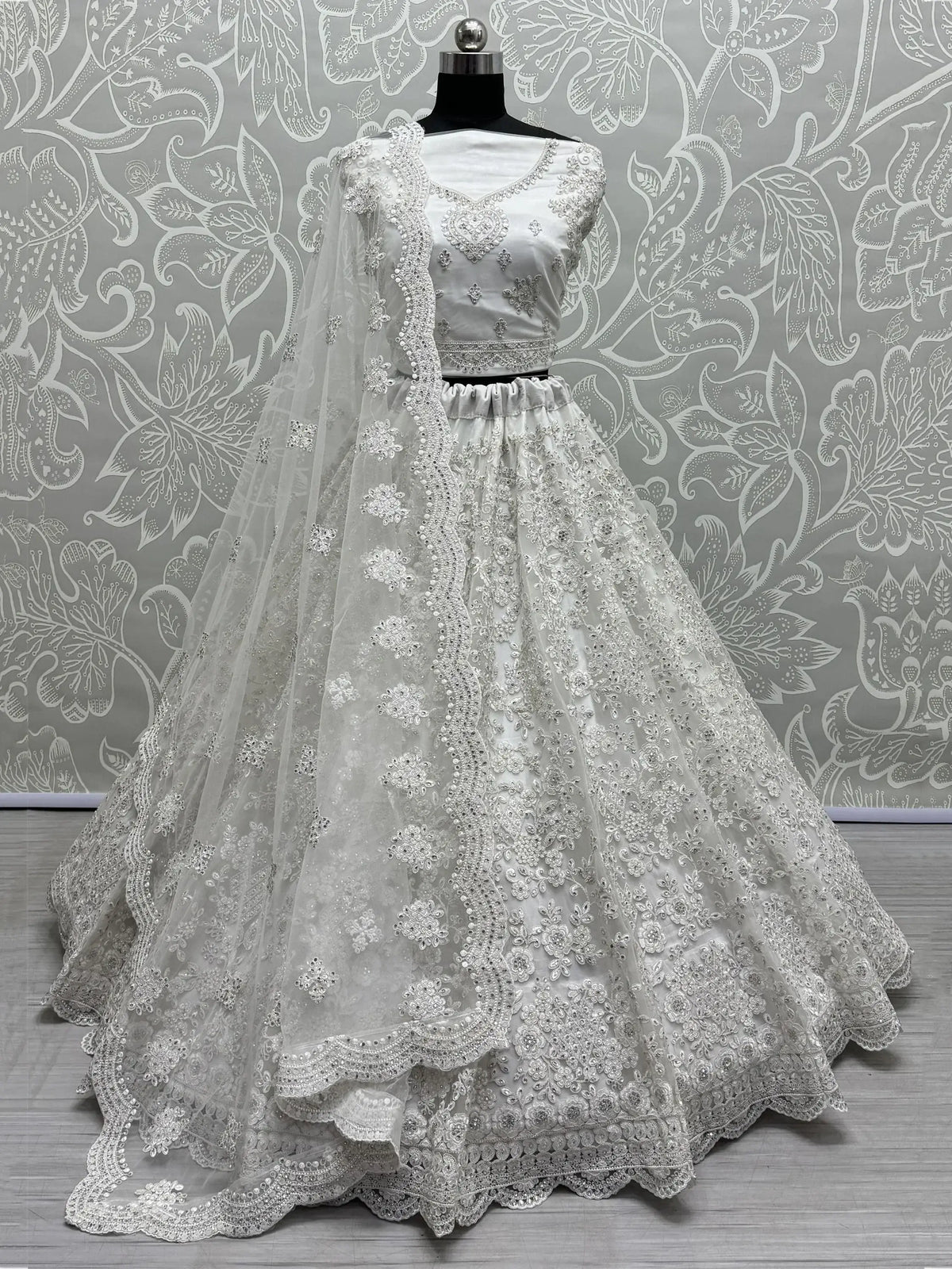 Gorgeous White Embroidered Net Reception Wear Lehenga Choli