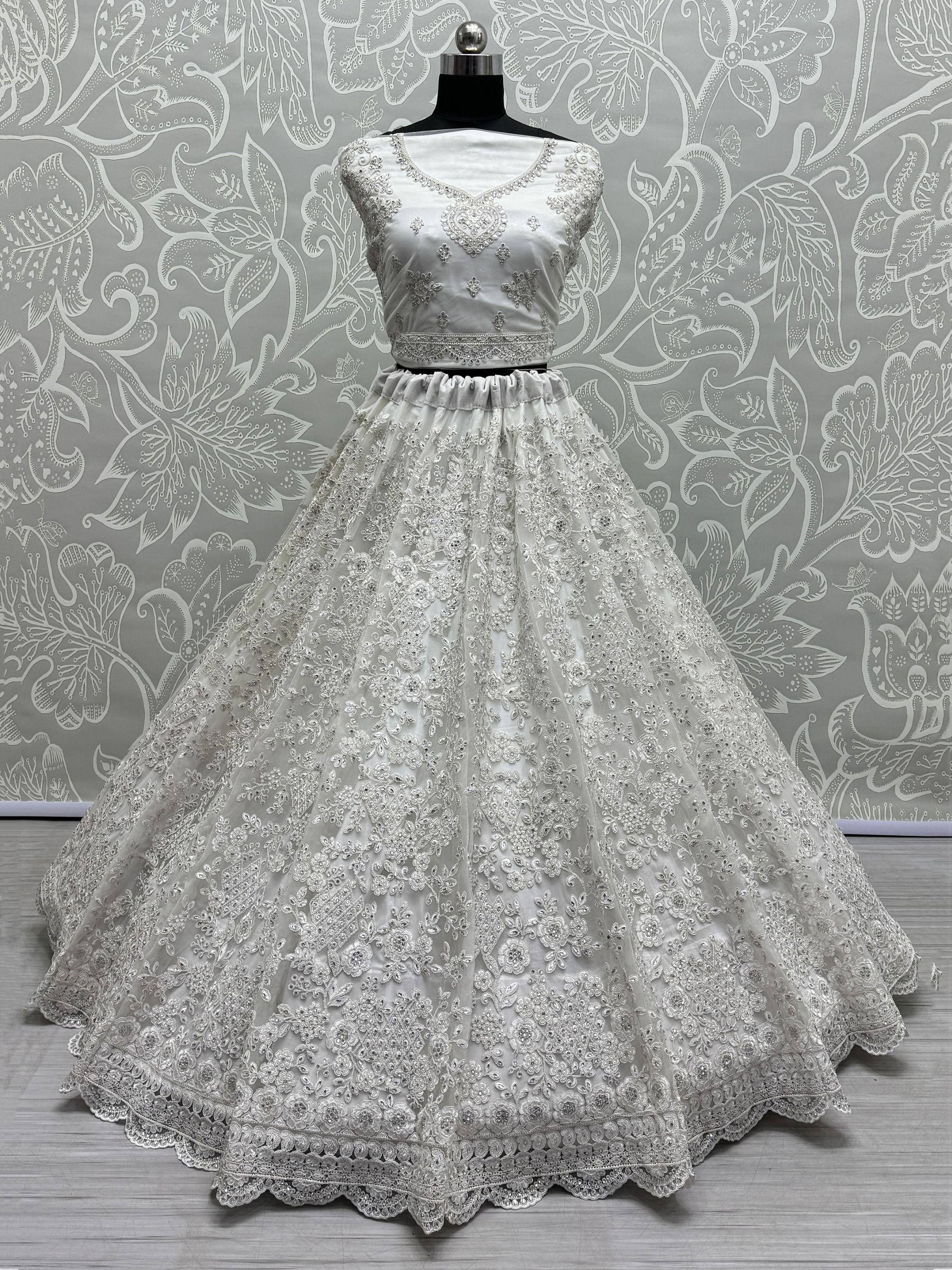 White embroidered lehenga choli with floral lace, perfect for Indian weddings and festive occasions