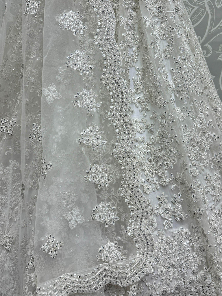 Gorgeous White Embroidered Net Reception Wear Lehenga Choli