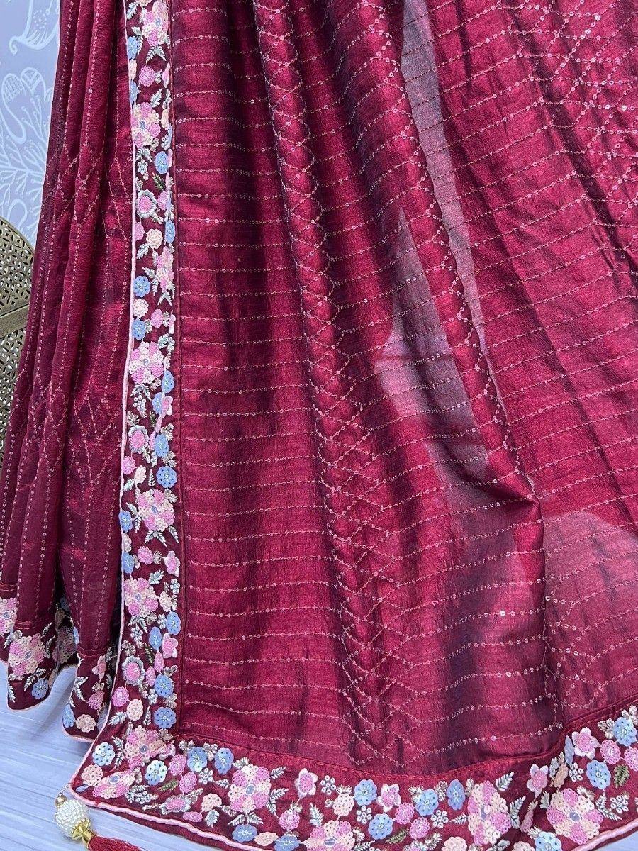 Maroon ethnic lehenga with floral embroidery and sequin detailing, perfect for Indian weddings and festivals