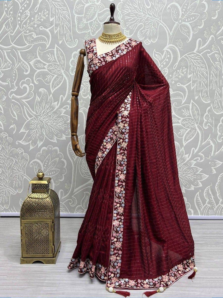 Maroon floral embroidered saree with gold jewelry, elegant Indian ethnic wear for women