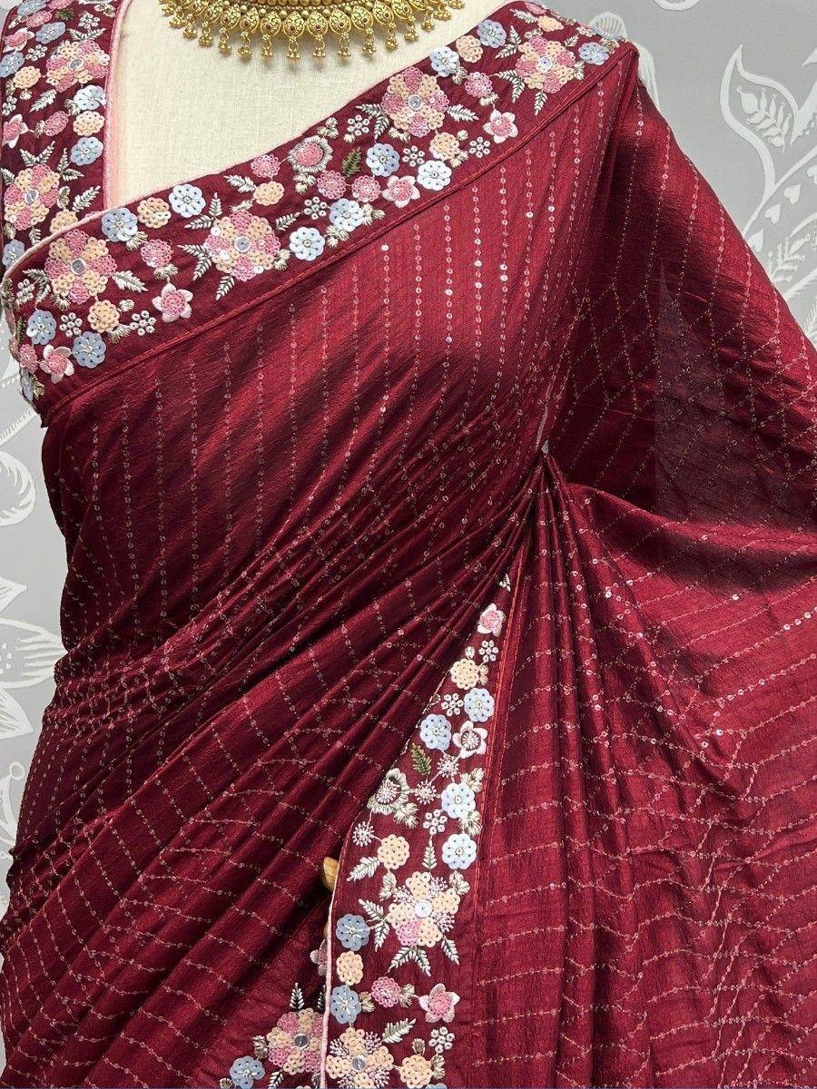 Maroon floral embroidered saree with sequin detailing, perfect for ethnic occasions