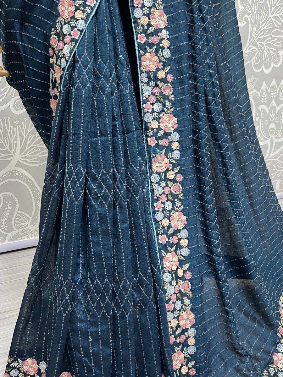 Dark blue ethnic gown with floral embroidery and geometric stitching, perfect for Indian occasions