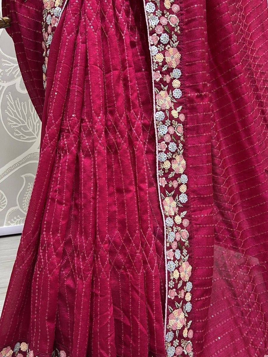 Rich maroon ethnic gown with floral embroidery and sequin detailing, perfect for Indian occasions.
